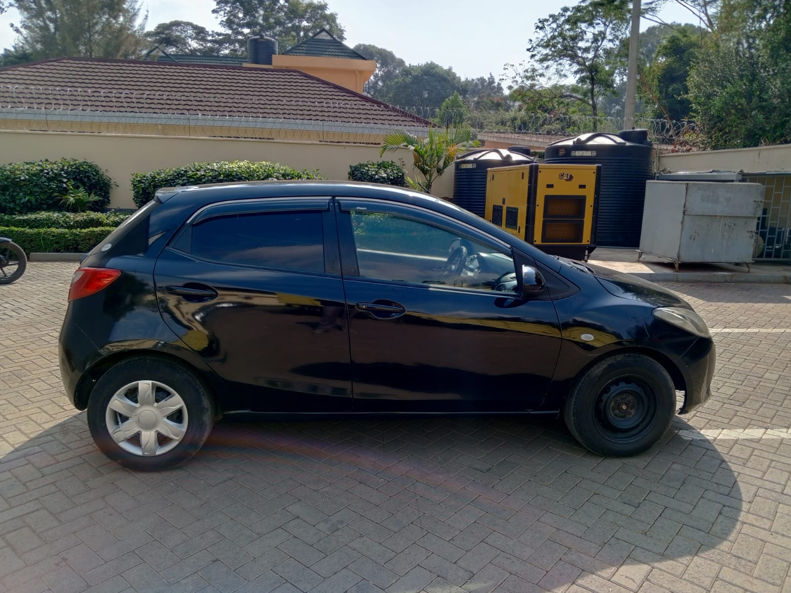 2009 MAZDA Demio - Peach Cars