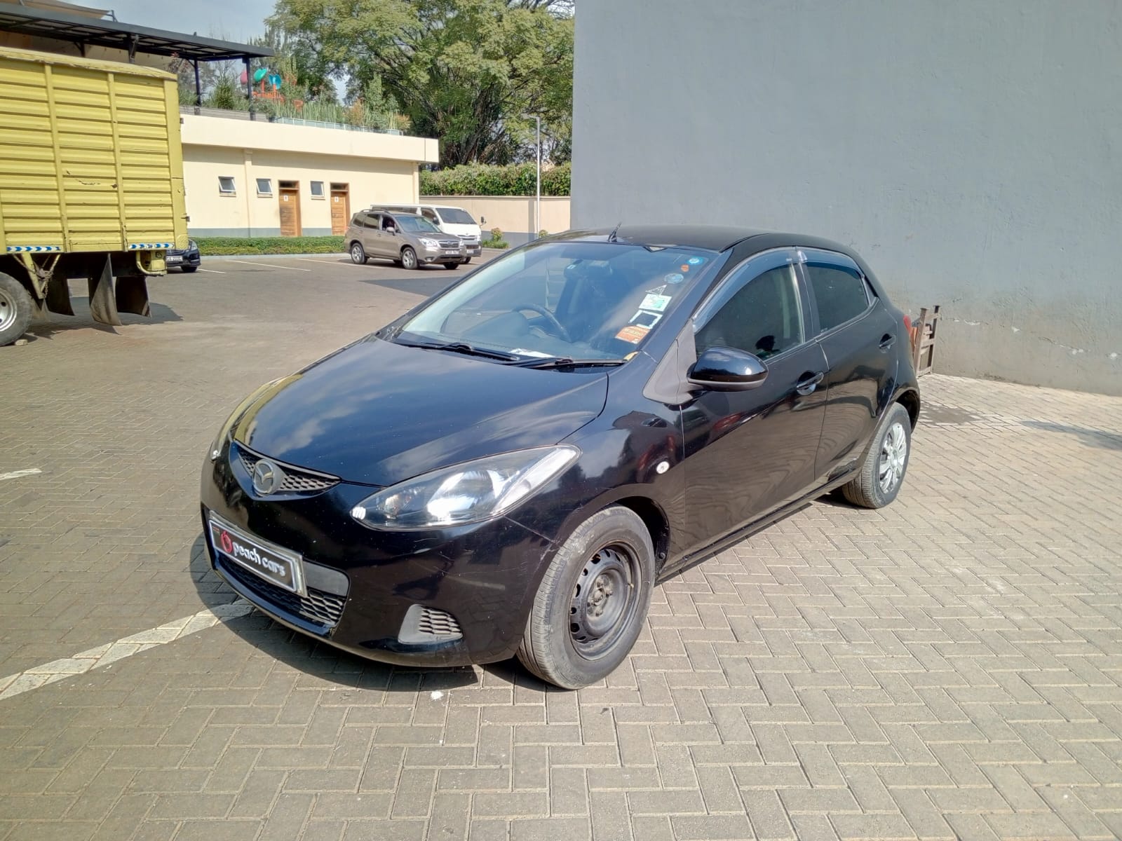 2009 MAZDA Demio - Peach Cars