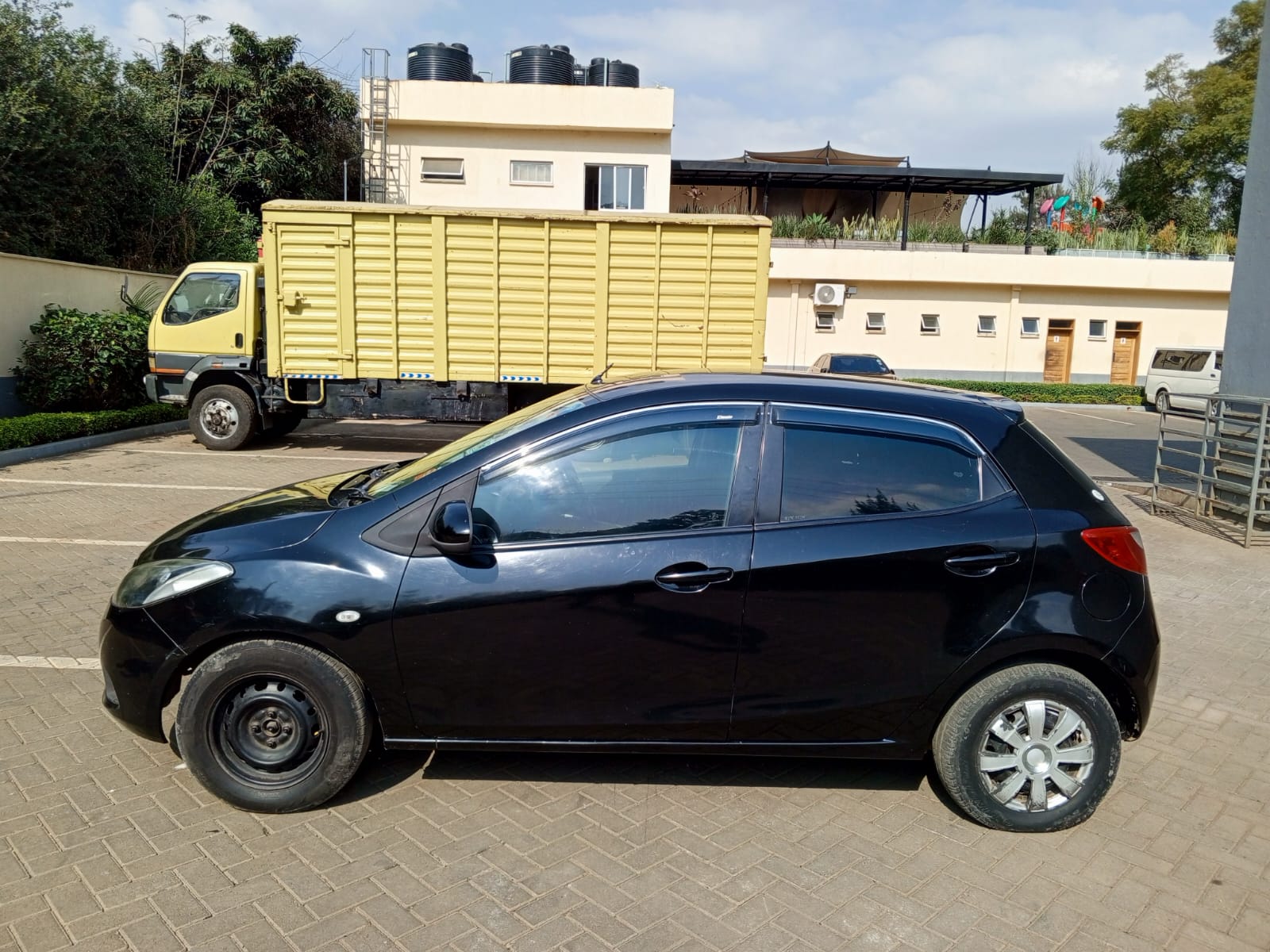2009 MAZDA Demio - Peach Cars