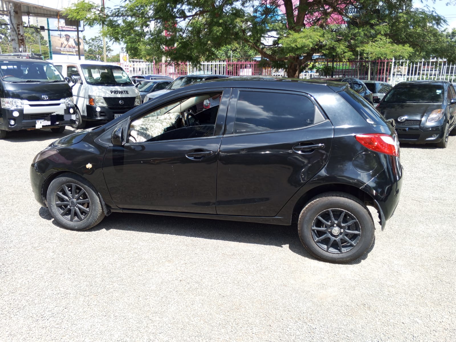 2009 MAZDA Demio - Peach Cars