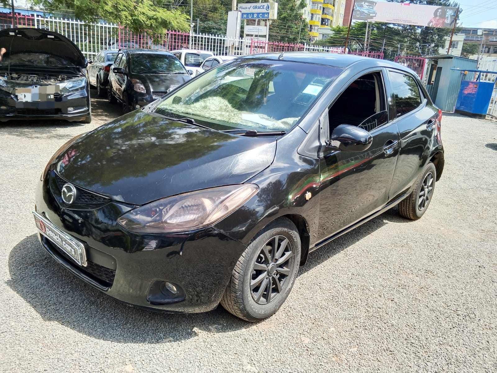 2009 MAZDA Demio - Peach Cars